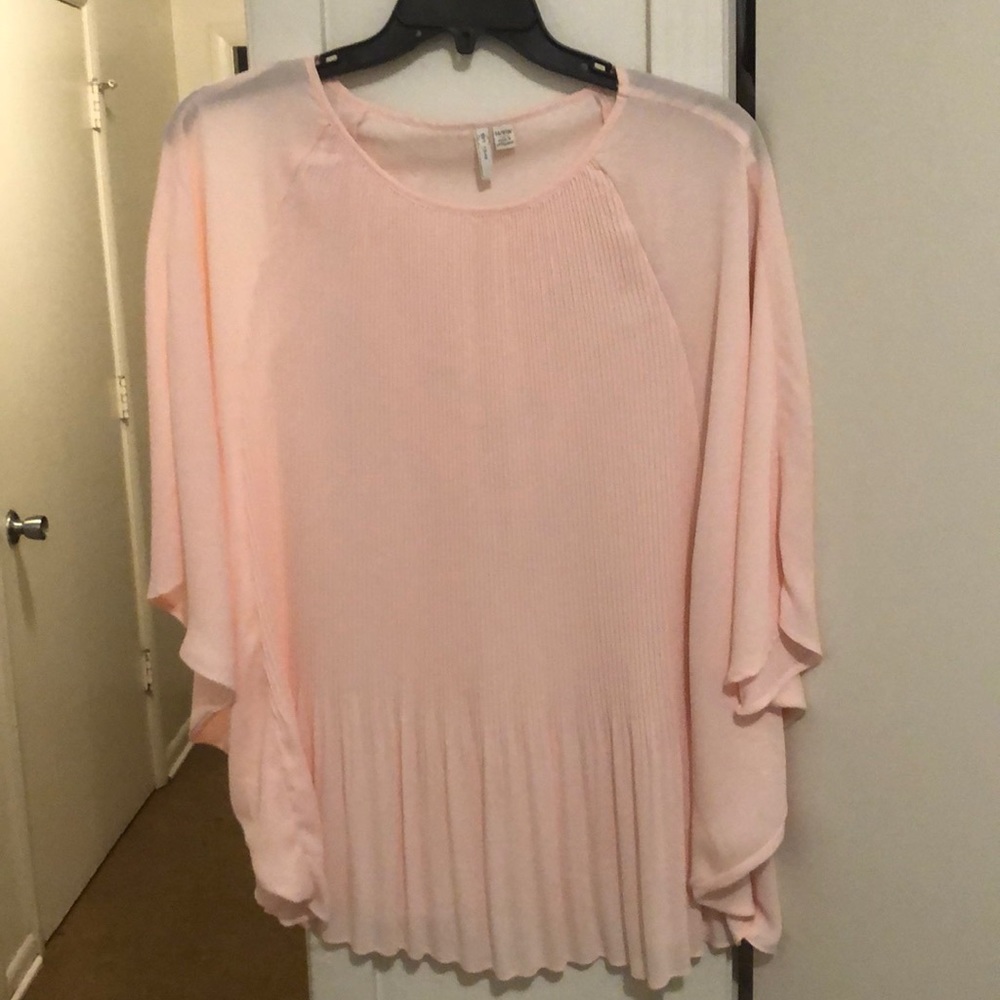 Pale pink tunic.